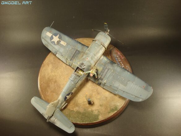 "Heavily weathered underside of F4U-1 Corsair 126 with realistic oil and dust effects simulating coral strip operations".