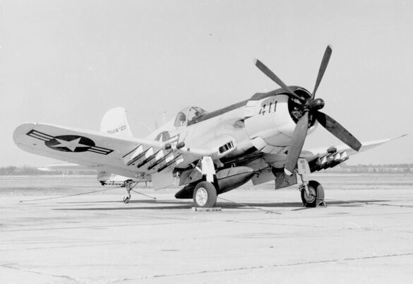 “Vought AU-1 Corsair in Light Gull Gray over Insignia White parked at NAS North Island, January 1956 – side profile with underwing pylons visible.”