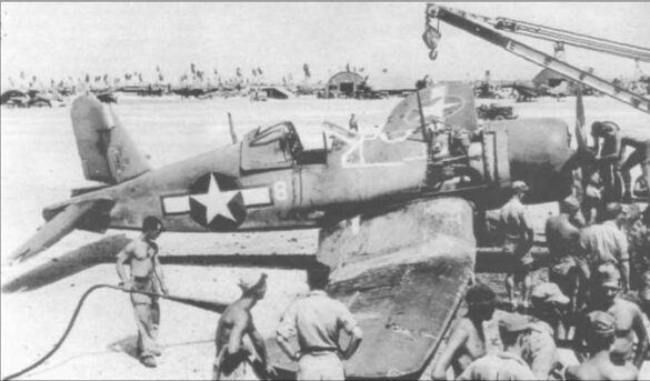 alt="1/48 scale Pacific airfield diorama with PSP and fuel truck" alt="US WW2 bomb cart and drums beside F4U Corsair" alt="Ground crew and maintenance scene on jungle runway" alt="Diorama showing GMC fuel bowser and PSP strip" alt="Scale model US bomb hoist in tropical airfield setting"