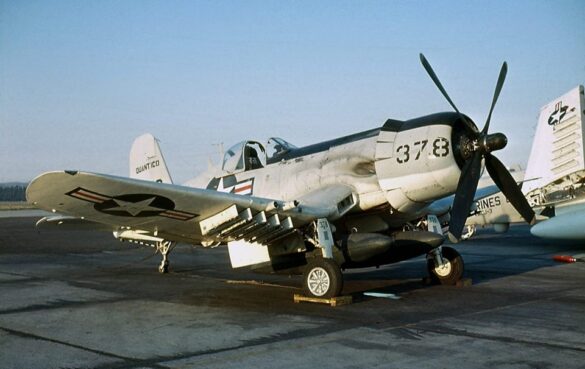 “Vought AU-1 Corsair in Light Gull Gray over Insignia White parked at NAS North Island, January 1956 – side profile with underwing pylons visible.”