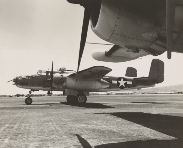 "USMC PBJ-1H Mitchell with radar pod and rocket launchers on a Pacific island, 1945"
