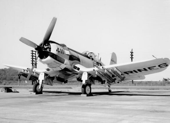 “Vought AU-1 Corsair in Light Gull Gray over Insignia White parked at NAS North Island, January 1956 – side profile with underwing pylons visible.”
