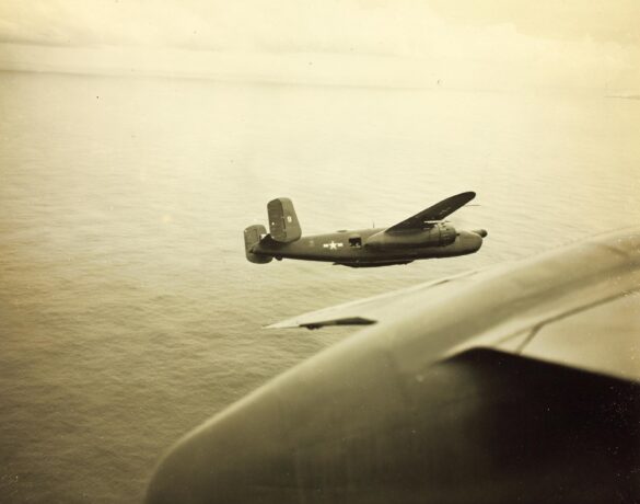 "USMC PBJ-1H Mitchell with radar pod and rocket launchers on a Pacific island, 1945"