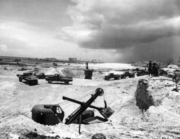 alt="1/48 scale Pacific airfield diorama with PSP and fuel truck" alt="US WW2 bomb cart and drums beside F4U Corsair" alt="Ground crew and maintenance scene on jungle runway" alt="Diorama showing GMC fuel bowser and PSP strip" alt="Scale model US bomb hoist in tropical airfield setting"