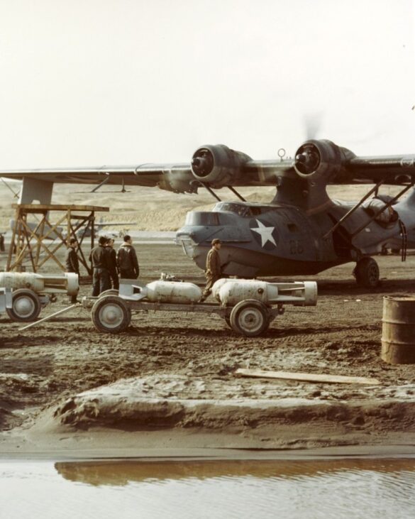 alt="1/48 scale Pacific airfield diorama with PSP and fuel truck" alt="US WW2 bomb cart and drums beside F4U Corsair" alt="Ground crew and maintenance scene on jungle runway" alt="Diorama showing GMC fuel bowser and PSP strip" alt="Scale model US bomb hoist in tropical airfield setting"