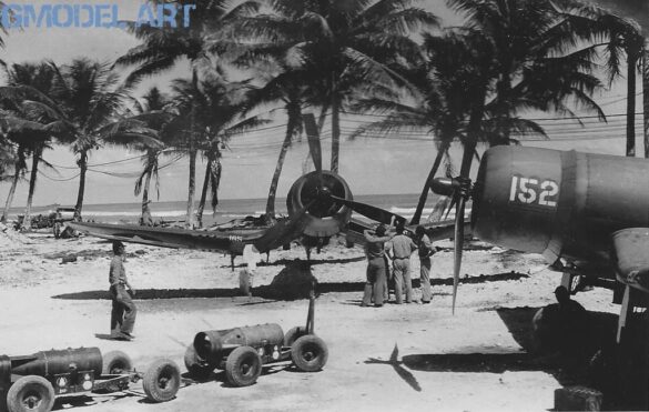 alt="1/48 scale Pacific airfield diorama with PSP and fuel truck" alt="US WW2 bomb cart and drums beside F4U Corsair" alt="Ground crew and maintenance scene on jungle runway" alt="Diorama showing GMC fuel bowser and PSP strip" alt="Scale model US bomb hoist in tropical airfield setting"