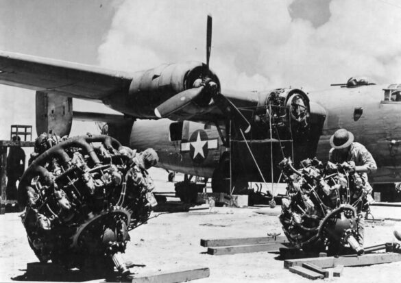 alt="1/48 scale Pacific airfield diorama with PSP and fuel truck" alt="US WW2 bomb cart and drums beside F4U Corsair" alt="Ground crew and maintenance scene on jungle runway" alt="Diorama showing GMC fuel bowser and PSP strip" alt="Scale model US bomb hoist in tropical airfield setting"