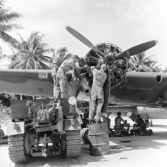 "1/48 scale Pacific airfield diorama with PSP and fuel truck" alt="US WW2 bomb cart and drums beside F4U Corsair" alt="Ground crew and maintenance scene on jungle runway" alt="Diorama showing GMC fuel bowser and PSP strip" alt="Scale model US bomb hoist in tropical airfield setting"