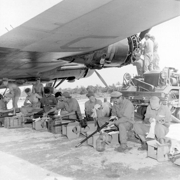 alt="1/48 scale Pacific airfield diorama with PSP and fuel truck" alt="US WW2 bomb cart and drums beside F4U Corsair" alt="Ground crew and maintenance scene on jungle runway" alt="Diorama showing GMC fuel bowser and PSP strip" alt="Scale model US bomb hoist in tropical airfield setting"