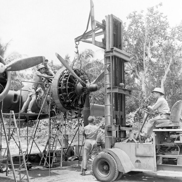 alt="1/48 scale Pacific airfield diorama with PSP and fuel truck" alt="US WW2 bomb cart and drums beside F4U Corsair" alt="Ground crew and maintenance scene on jungle runway" alt="Diorama showing GMC fuel bowser and PSP strip" alt="Scale model US bomb hoist in tropical airfield setting"