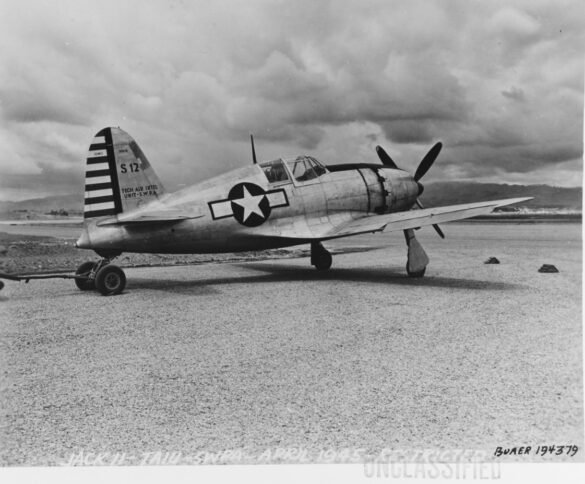 Close-up of J2M3 Raiden’s nose showing white US star insignia and propeller detail.