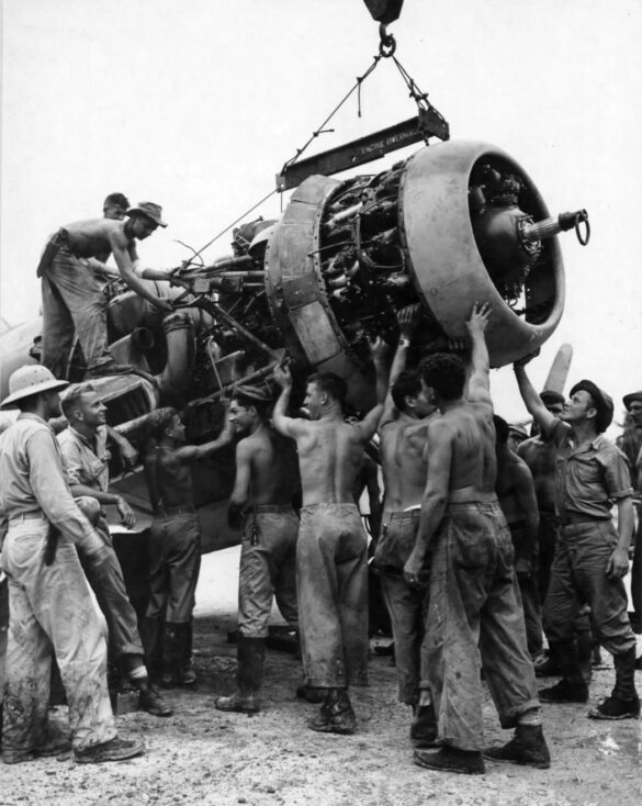 alt="1/48 scale Pacific airfield diorama with PSP and fuel truck" alt="US WW2 bomb cart and drums beside F4U Corsair" alt="Ground crew and maintenance scene on jungle runway" alt="Diorama showing GMC fuel bowser and PSP strip" alt="Scale model US bomb hoist in tropical airfield setting"