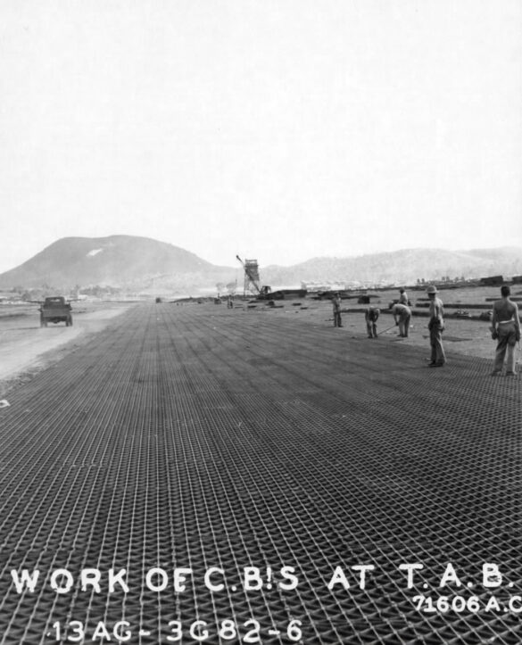 alt="1/48 scale Pacific airfield diorama with PSP and fuel truck" alt="US WW2 bomb cart and drums beside F4U Corsair" alt="Ground crew and maintenance scene on jungle runway" alt="Diorama showing GMC fuel bowser and PSP strip" alt="Scale model US bomb hoist in tropical airfield setting"