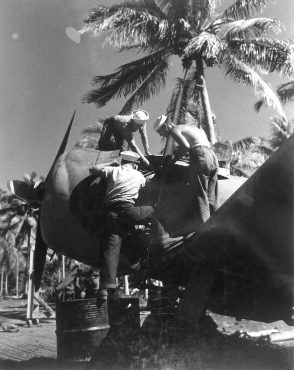 alt="1/48 scale Pacific airfield diorama with PSP and fuel truck" alt="US WW2 bomb cart and drums beside F4U Corsair" alt="Ground crew and maintenance scene on jungle runway" alt="Diorama showing GMC fuel bowser and PSP strip" alt="Scale model US bomb hoist in tropical airfield setting"