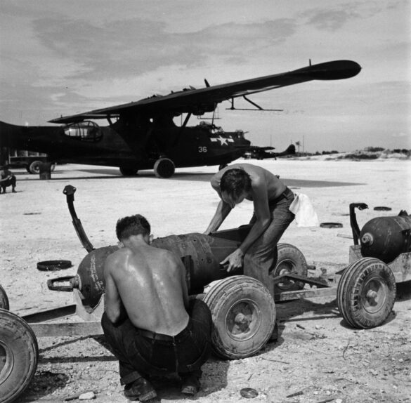 alt="1/48 scale Pacific airfield diorama with PSP and fuel truck" alt="US WW2 bomb cart and drums beside F4U Corsair" alt="Ground crew and maintenance scene on jungle runway" alt="Diorama showing GMC fuel bowser and PSP strip" alt="Scale model US bomb hoist in tropical airfield setting"