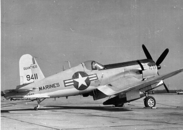 “Vought AU-1 Corsair in Light Gull Gray over Insignia White parked at NAS North Island, January 1956 – side profile with underwing pylons visible.”