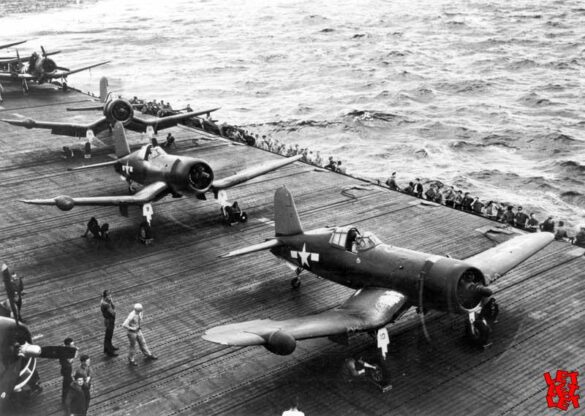 "F4U-2(N) Corsair night fighter with radar dome on right wingtip – VF(N)-101, USS Enterprise, 1944" "Modified F4U-1A Corsair converted to night fighter configuration – VMF(N)-532, Roi Island base, 1944" "US Navy F4U-2 Corsair with flame arrestors and black-over-blue night camouflage" "Close-up of AIA radar dome installed on F4U-2 wing – early WWII night fighter technology" "Cockpit interior of F4U-2(N) with Sperry autopilot and radar display"