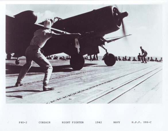 "F4U-2(N) Corsair night fighter with radar dome on right wingtip – VF(N)-101, USS Enterprise, 1944" "Modified F4U-1A Corsair converted to night fighter configuration – VMF(N)-532, Roi Island base, 1944" "US Navy F4U-2 Corsair with flame arrestors and black-over-blue night camouflage" "Close-up of AIA radar dome installed on F4U-2 wing – early WWII night fighter technology" "Cockpit interior of F4U-2(N) with Sperry autopilot and radar display"