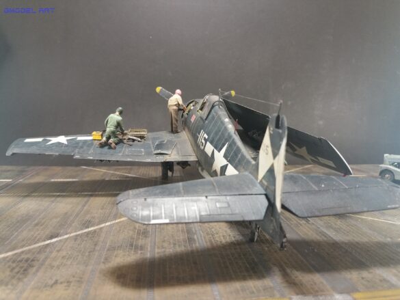 Eduard 1/48 F6F-5 Hellcat “White 115” parked on US Navy carrier deck diorama – folded wings and weathered WWII carrier fighter scene