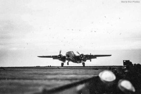 "USMC PBJ-1H Mitchell with radar pod and rocket launchers on a Pacific island, 1945"
