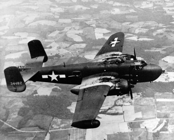 "USMC PBJ-1H Mitchell with radar pod and rocket launchers on a Pacific island, 1945"