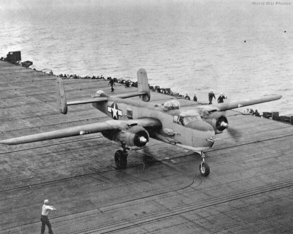 "USMC PBJ-1H Mitchell with radar pod and rocket launchers on a Pacific island, 1945"