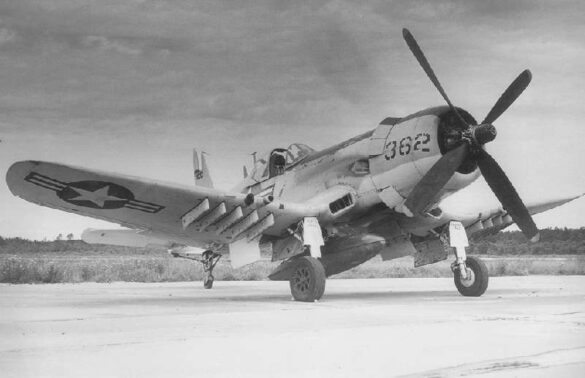 “Vought AU-1 Corsair in Light Gull Gray over Insignia White parked at NAS North Island, January 1956 – side profile with underwing pylons visible.”