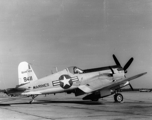 “Vought AU-1 Corsair in Light Gull Gray over Insignia White parked at NAS North Island, January 1956 – side profile with underwing pylons visible.”