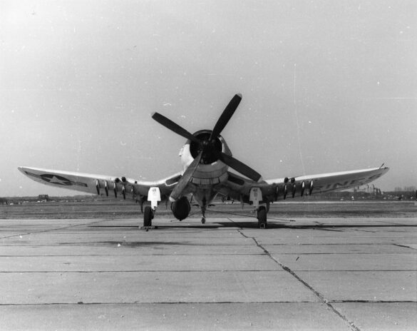 “Vought AU-1 Corsair in Light Gull Gray over Insignia White parked at NAS North Island, January 1956 – side profile with underwing pylons visible.”