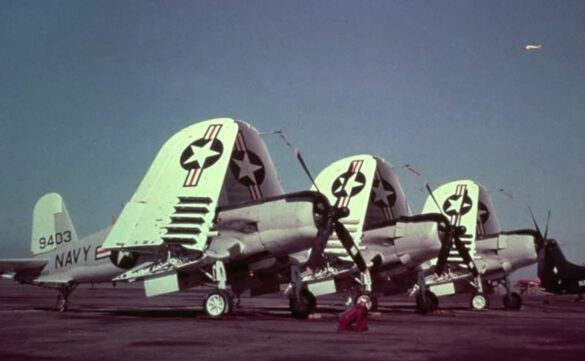 “Vought AU-1 Corsair in Light Gull Gray over Insignia White parked at NAS North Island, January 1956 – side profile with underwing pylons visible.”