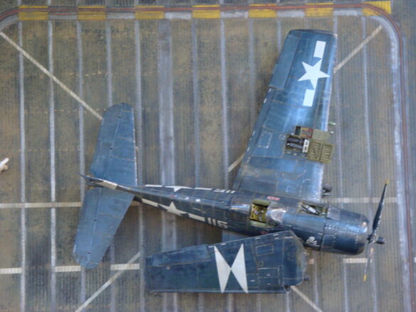 Eduard 1/48 F6F-5 Hellcat “White 115” parked on US Navy carrier deck diorama – folded wings and weathered WWII carrier fighter scene
