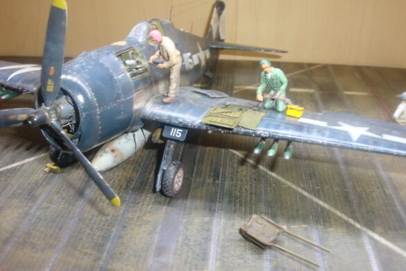Eduard 1/48 F6F-5 Hellcat “White 115” parked on US Navy carrier deck diorama – folded wings and weathered WWII carrier fighter scene