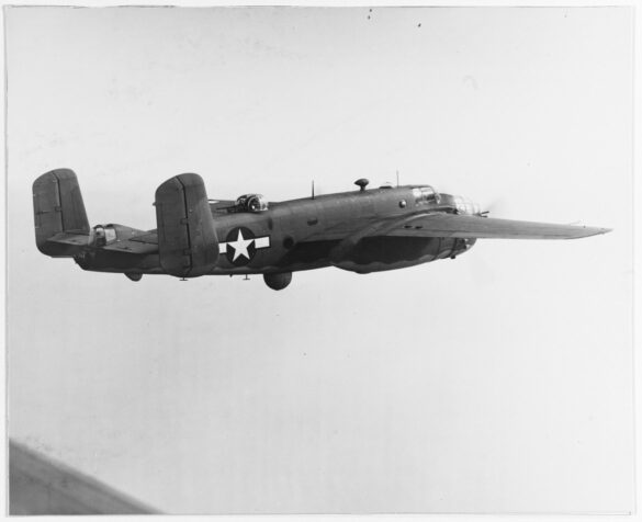 "USMC PBJ-1H Mitchell with radar pod and rocket launchers on a Pacific island, 1945"