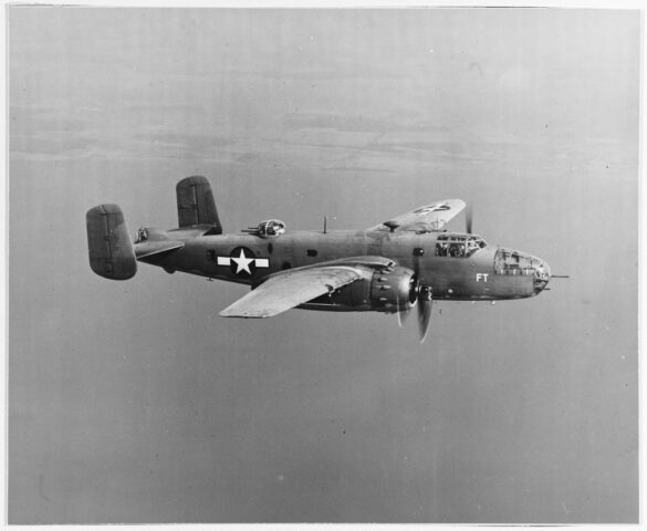 "USMC PBJ-1H Mitchell with radar pod and rocket launchers on a Pacific island, 1945"