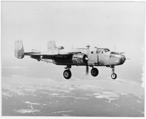 "USMC PBJ-1H Mitchell with radar pod and rocket launchers on a Pacific island, 1945"