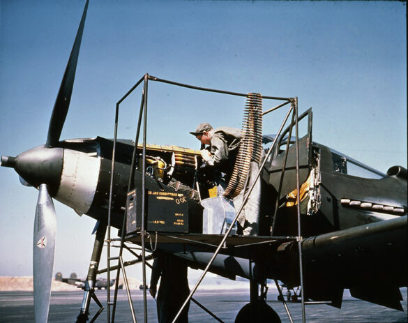 alt="1/48 scale Pacific airfield diorama with PSP and fuel truck" alt="US WW2 bomb cart and drums beside F4U Corsair" alt="Ground crew and maintenance scene on jungle runway" alt="Diorama showing GMC fuel bowser and PSP strip" alt="Scale model US bomb hoist in tropical airfield setting"