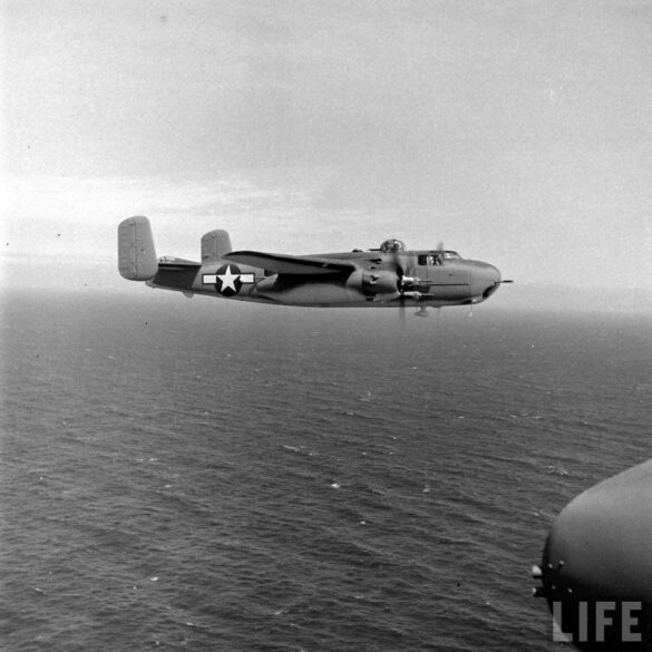 "USMC PBJ-1H Mitchell with radar pod and rocket launchers on a Pacific island, 1945"