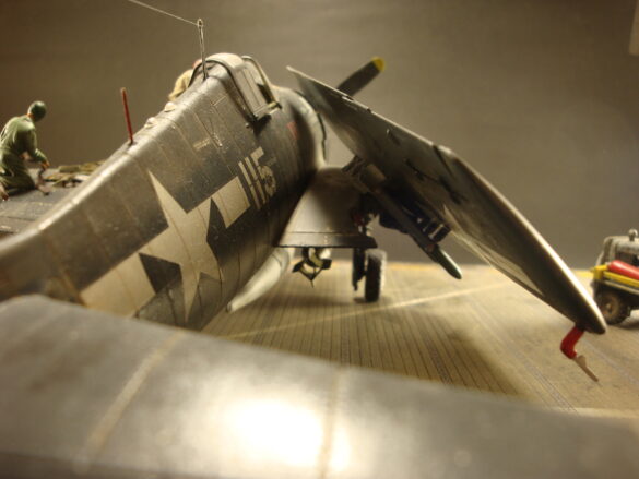 Eduard 1/48 F6F-5 Hellcat “White 115” parked on US Navy carrier deck diorama – folded wings and weathered WWII carrier fighter scene