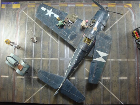 Eduard 1/48 F6F-5 Hellcat “White 115” parked on US Navy carrier deck diorama – folded wings and weathered WWII carrier fighter scene