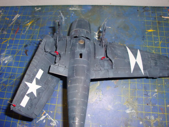 Eduard 1/48 F6F-5 Hellcat “White 115” parked on US Navy carrier deck diorama – folded wings and weathered WWII carrier fighter scene