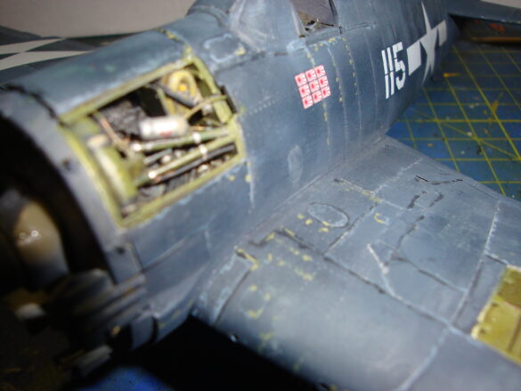 Eduard 1/48 F6F-5 Hellcat “White 115” parked on US Navy carrier deck diorama – folded wings and weathered WWII carrier fighter scene