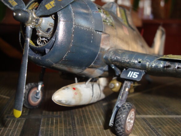 Eduard 1/48 F6F-5 Hellcat “White 115” parked on US Navy carrier deck diorama – folded wings and weathered WWII carrier fighter scene