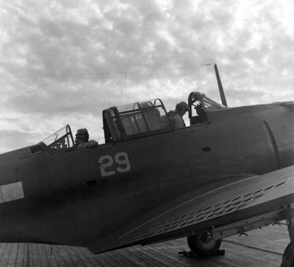 F6F Hellcat – Air Group 16 USS Lexington (CV-16) F6F-3 Hellcat Air Group 16 in tricolor variant aboard USS Lexington CV-16 with pilots before the mission