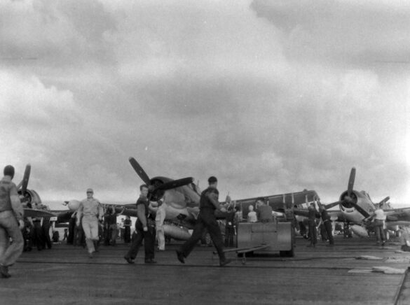 F6F Hellcat – Air Group 16 USS Lexington (CV-16) F6F-3 Hellcat Air Group 16 in tricolor variant aboard USS Lexington CV-16 with pilots before the mission