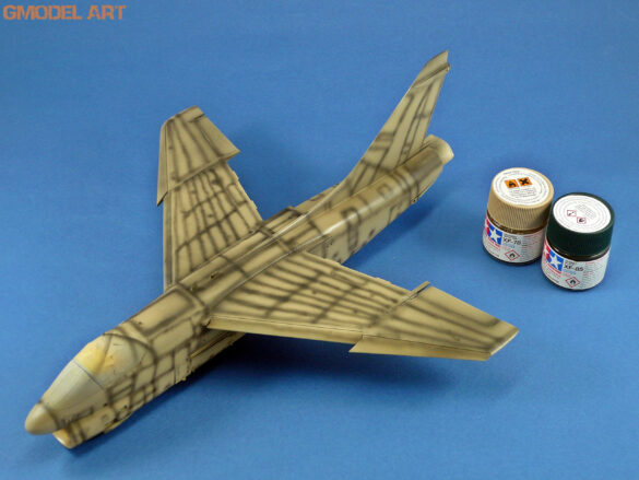 Model airplane with paint jars