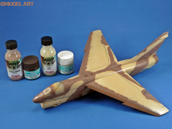 Model airplane with paint bottles