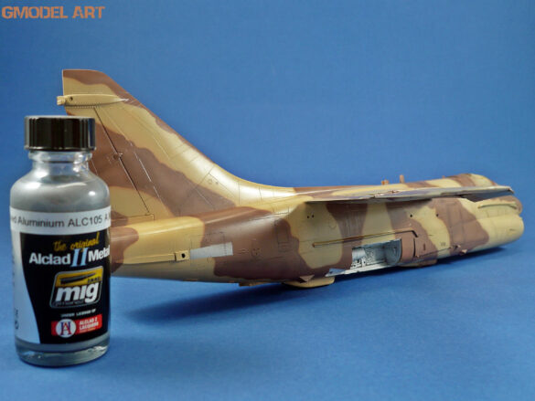 Model airplane with paint bottle