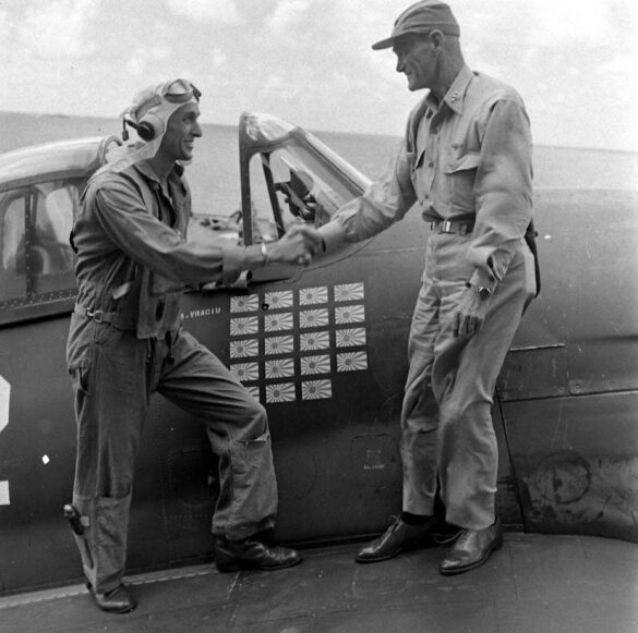 F6F Hellcat – Air Group 16 USS Lexington (CV-16) F6F-3 Hellcat Air Group 16 in tricolor variant aboard USS Lexington CV-16 with pilots before the mission