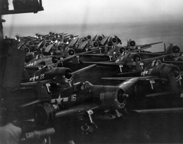 F6F Hellcat – Air Group 16 USS Lexington (CV-16) F6F-3 Hellcat Air Group 16 in tricolor variant aboard USS Lexington CV-16 with pilots before the mission
