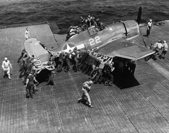 F6F Hellcat – Air Group 16 USS Lexington (CV-16) F6F-3 Hellcat Air Group 16 in tricolor variant aboard USS Lexington CV-16 with pilots before the mission